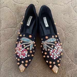 Elegant Black Flats with Cherry Embellishments